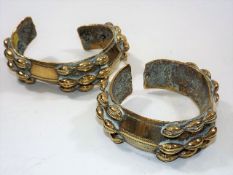 A Pair Of 19thC. African Brass Cowrie Shell Curren