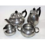 A Tudric Hammered Pewter Tea & Coffee Service