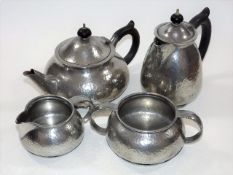 A Tudric Hammered Pewter Tea & Coffee Service