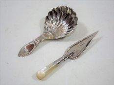 A Silver Shell Shaped Caddy Spoon Twinned With A M