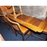 A 1930'S Oak Extending Table With Four Leather Cov