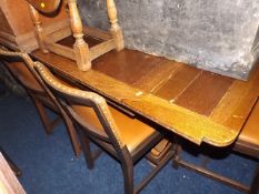 A 1930'S Oak Extending Table With Four Leather Cov