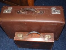 A Small Leather Suitcase & One Other