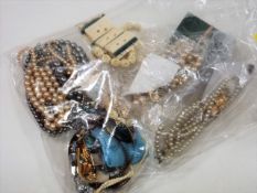 A Bagged Selection Of Costume Pearls & Bone Items