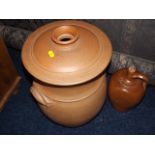 A Large Earthenware Lidded Pot Twinned With A Ston