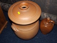 A Large Earthenware Lidded Pot Twinned With A Ston