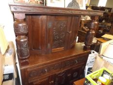 A Gothic Style Court Cupboard With Horse & Fox Hea