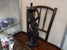 A Carved African Figure