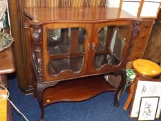 A Mahogany Glazed Display Cabinet With Mirror Back