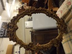 An Oval Gilt Framed Mirror
