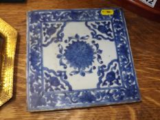 An antique blue & white Chinese porcelain tile, some faults