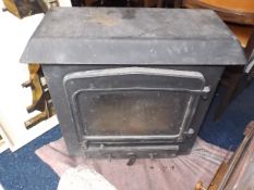 A Cast Iron Log Burner Twinned With One Other