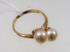 A 9ct Gold Ring With Two Pearls
