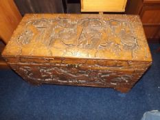 An Oriental Carved Camphor Wood Chest