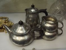 An Arts & Crafts Style Tudric Pewter Four Piece Te