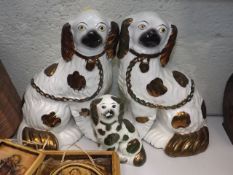 A Pair Of Staffordshire Dogs & One Smaller