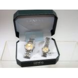 A Boxed His & Hers Wrist Watch Set