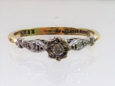 An 18ct Gold Diamond Ring With White Metal Mounts