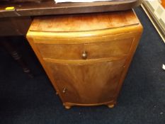 A Small Lightwood Bedside Cabinet With Brass Handl