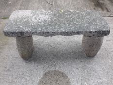 A Free Standing Pink Granite Garden Bench With Ton