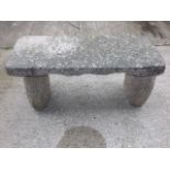 A Free Standing Pink Granite Garden Bench With Ton