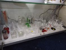 A Shelf Containing Various Glassware Items