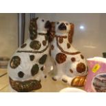 A Pair Of Staffordshire Dog Figures