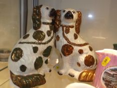 A Pair Of Staffordshire Dog Figures