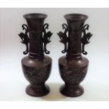 A pair of 1920's Japanese bronze vases