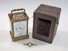 A Victorian brass alarm carriage clock with carry