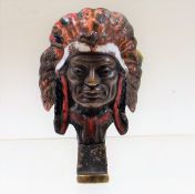 An enamelled bronze American Chief Indian car / motorcycle mascot, some losses to enamelling