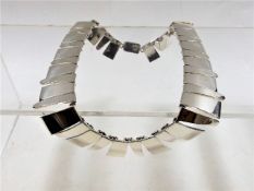 An art deco style silver necklace