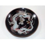 A dragon pattern on black ground cloisonne plate