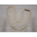 A set of cultured pearls with gold clasp