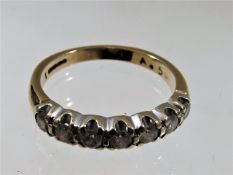 An 18ct gold ring set with seven diamonds