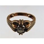 A 9ct gold ring set with diamond
