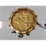 A mounted gold sovereign dated 1914