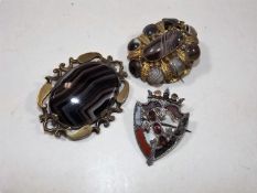 A silver mounted & two yellow metal mounted agate