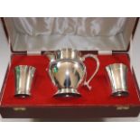 A boxed heavy gauge silver whisky water jug & tumb