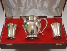 A boxed heavy gauge silver whisky water jug & tumb