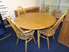 A 1970'S Ercol Retro Elm Dining Suite With Two Car