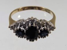 A 9ct gold diamond & sapphire ring