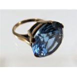 A 9ct ring with large blue stone