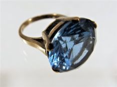 A 9ct ring with large blue stone