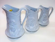 Three mid 19thC. graduated porcelain jugs with hea