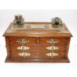 A Victorian Oak & Brass Inkwell Cabinet, Some Faul