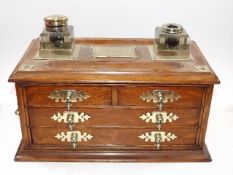 A Victorian Oak & Brass Inkwell Cabinet, Some Faul