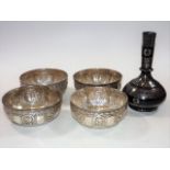 Four Indian silver bowls twinned with a silver inl