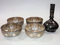 Four Indian silver bowls twinned with a silver inl