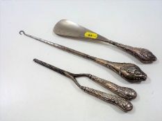A silver handled pair of glover stretchers twinned